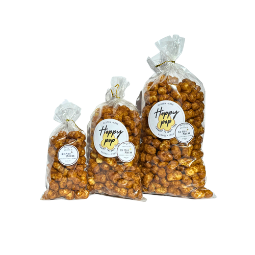Three bags of light brown marbled popcorn from smallest to largest in clear twist bags 